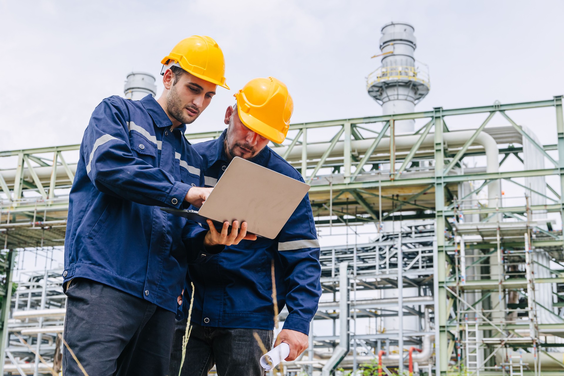 Engineer worker team working outdoor, Surveyor teamwork survey gas pipe oil transport pipeline deploy building project for refinery industry.